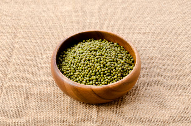 istock mung bean in wooden bowl on burlap background 1469884934