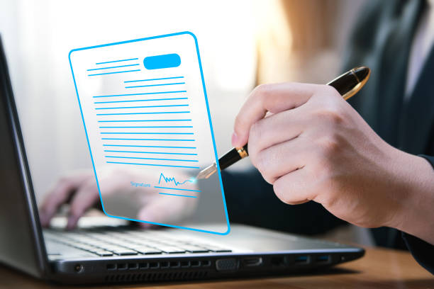 istock Electronic signature concept and technology and online document management (DMS) for paperless offices. 1469885021