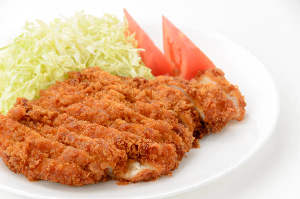 istock Chicken cutlet with shredded cabbage and tomato on plate on white background 1469885609