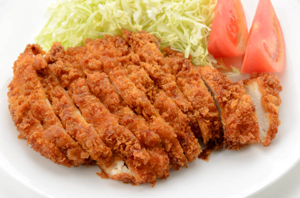 istock Chicken cutlet with shredded cabbage and tomato on plate on white background 1469885624