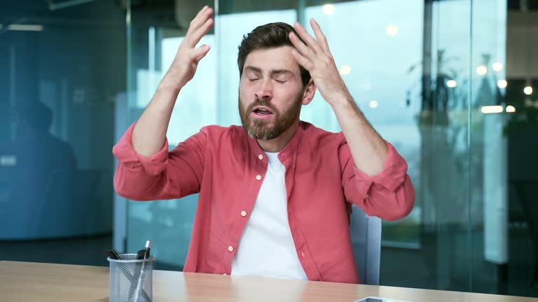 Webcam view of irritated arguing angry mature business man freelancer looking at the camera and yelling at online meeting conference video call expressing negative emotion