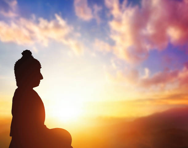istock Silhouette of Buddha on golden  sunset background 1469890932