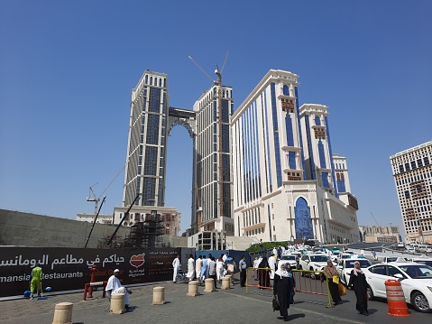 Dammam, Eastern Province, Saudi Arabia: view east along King Saud Street and the Al Hayat Plaza shopping center, façade with windcatchers, Al Hayat mosque in the background.