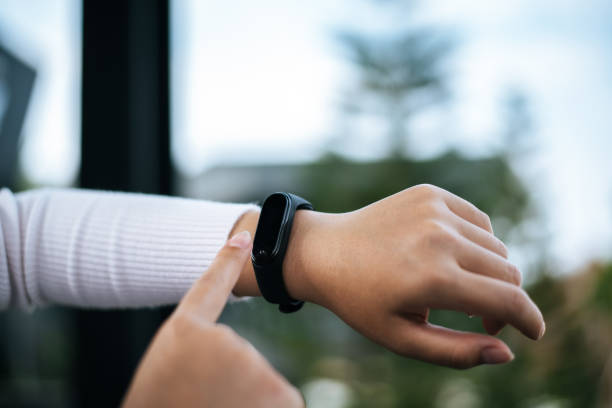 istock Young woman using smartwatch in cafe 1469896687