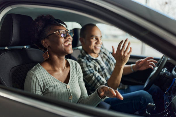 istock Cheerful black couple having fun on a trip in a car. 1469898781
