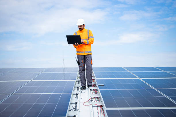 istock Solar company contractor checking functionality of solar photovoltaic panels. 1469900208