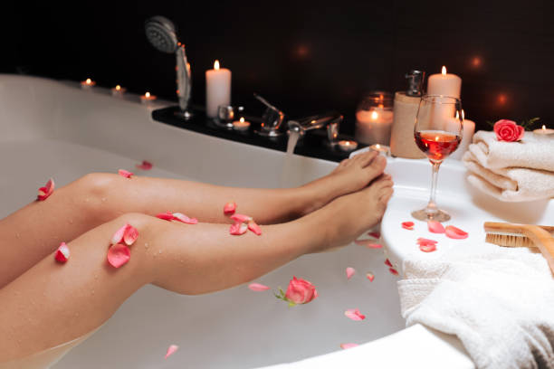 istock Woman taking bath with rose petals, closeup. Romantic atmosphere 1469900468