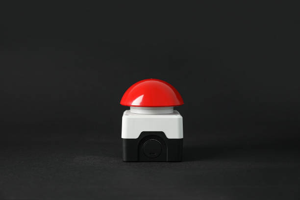 Red button of nuclear weapon on black background. War concept