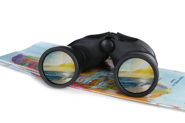 istock Binoculars and map on white background. Seascape reflecting in lenses 1469901102