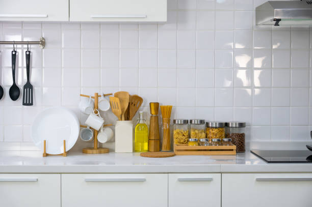 istock Kitchen utensils and kitchenware on white countertop at home 1469905554