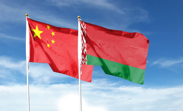 istock Chinese flag with Belarusian flag on cloudy sky. waving in the sky 1469907214