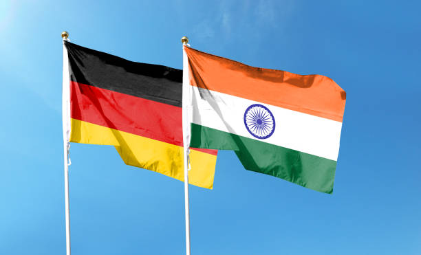 istock German flag with Indian flag on cloudy sky. waving in the sky 1469908314