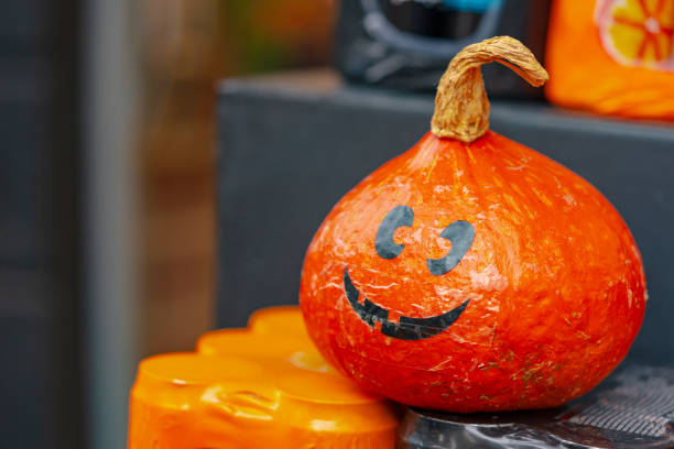 istock Halloween pumpkin in a market on a fruit shelf 1469909533