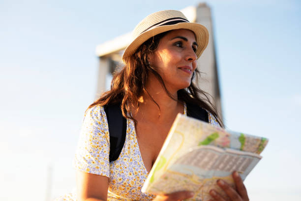 istock Happy young woman with a city map travelling. 1469909751