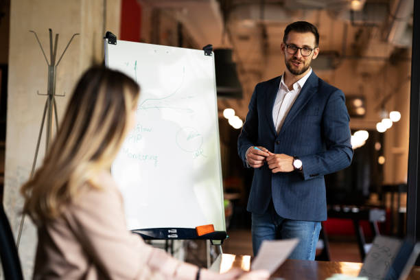 istock Businessman presents his idea to working team 1469910407