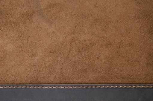 Texture of brown natural leather. Suede texture.