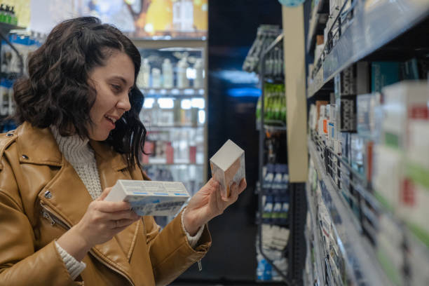 istock a woman chooses toothpaste in a store 1469912186
