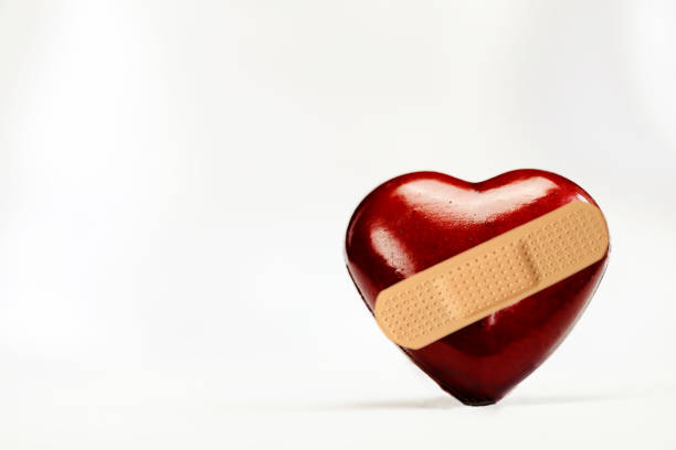istock Broken heart shape with bandage on white background with copy space, medical,health, broken love,heart broken illness concept 1469912438
