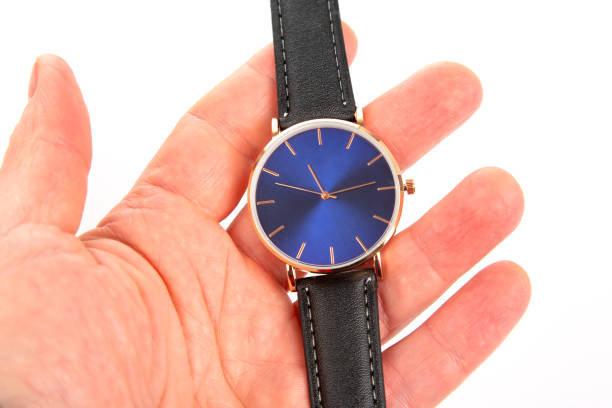 istock Wristwatch in hand on a white background 1469912482