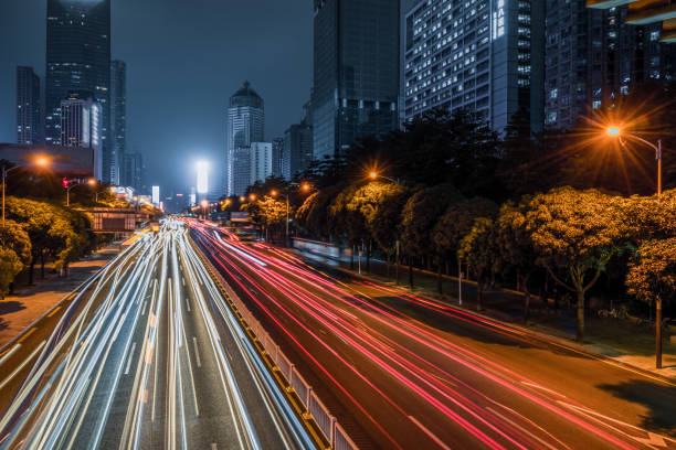 istock downtown cityscape at night with rush-hour traffic in China 1469913279