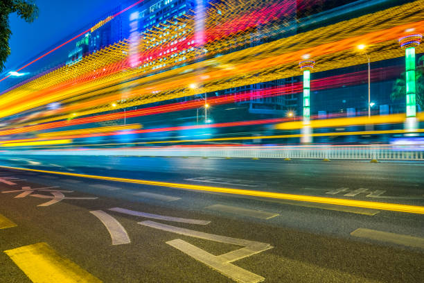 istock Vehicle light trails in city at night 1469913283