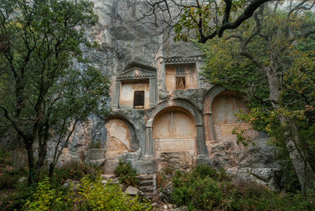 Rock tomb in the ancient city of Termessos Termessos, a mountain city, was founded by the Solymos (Solymites), known as a people fond of freedom. The Solymos mentioned in Homer's Iliad are known as the people of Termessos. The city of Termessos is one of the Psidia settlements in the Pamphylia region, established on the rocky slopes of Güllük Mountain. During the reign of Theodosius II in the 5th centuries AD, the location of the city was changed due to thirst.
This ancient city is located in the Güllük Mountain Termessos Historical National Park. termessos stock pictures, royalty-free photos & images