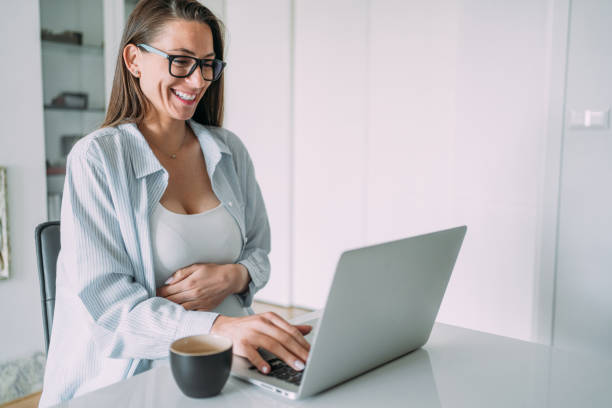 istock Pregnant woman working from home. 1469914043