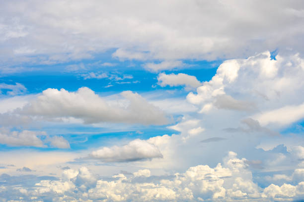 istock clouds and blue sunny sky,  white clouds over blue sky, Aerial view,  nature blue sky white cleat weather. 1469914871