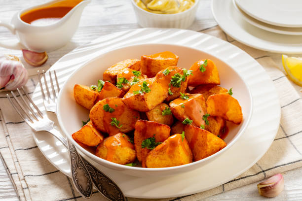 istock patatas bravas, deep fried potatoes with sauce 1469915473
