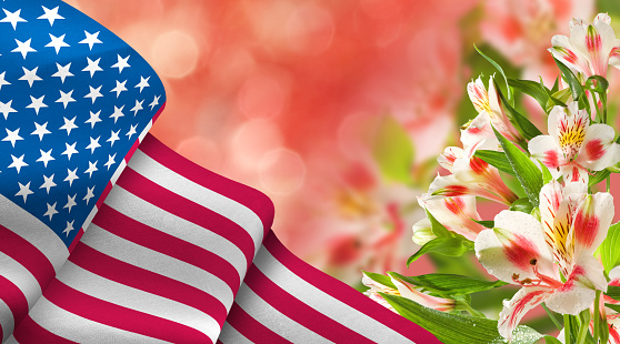 Image of the American flag along with beautiful flowers