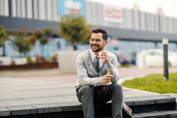 istock A young elegant businessman on a coffee break outside. 1469917333