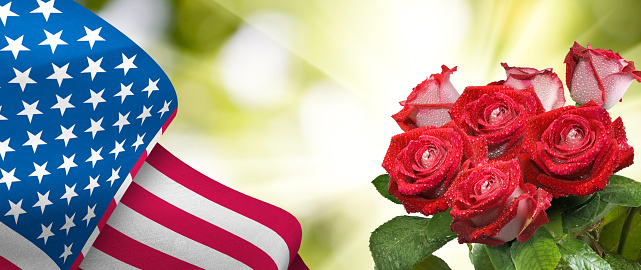Image of the American flag along with beautiful flowers
