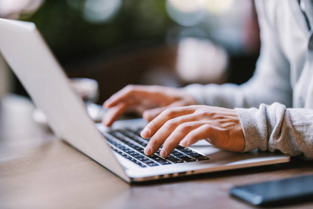 istock Close up of hands typing on a laptop. 1469918796