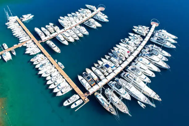 Photo of Yachts moored in the marina. Blue voyage. Boat tour.