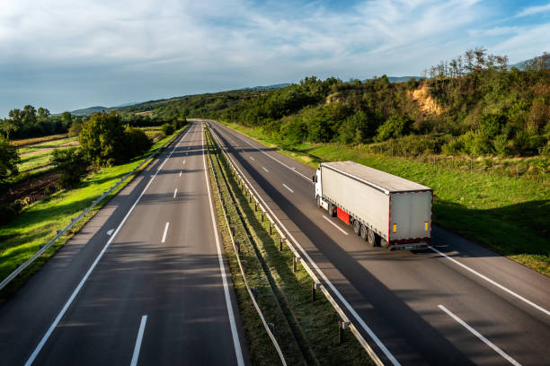 istock Truck with semi-trailer on highway 1469919262