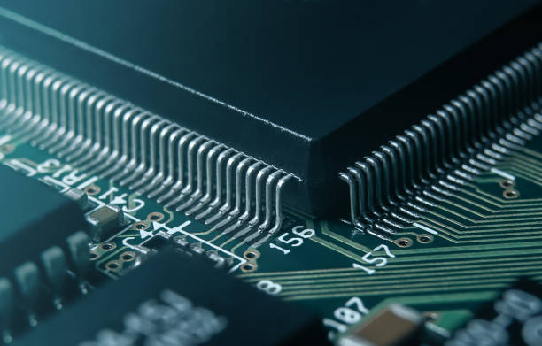 istock Macro photo of application specific integradet circuit in QFP package mounted on printed circuit board 1469920107