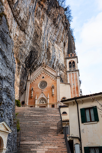 Historic  mountainside italian sanctuary, circa 1625. Santuario de la Madonna della Corona, church in the rock.  Beautiful mountain view, Verona province, Veneto, Italy. Vertical image.