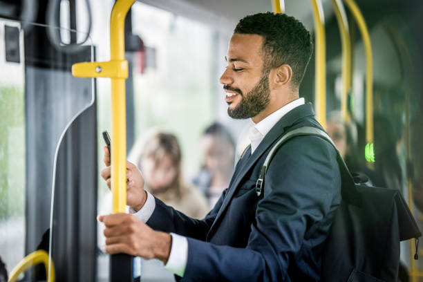 istock Businessman standing in bus and chatting on smartphone videocall 1469929237