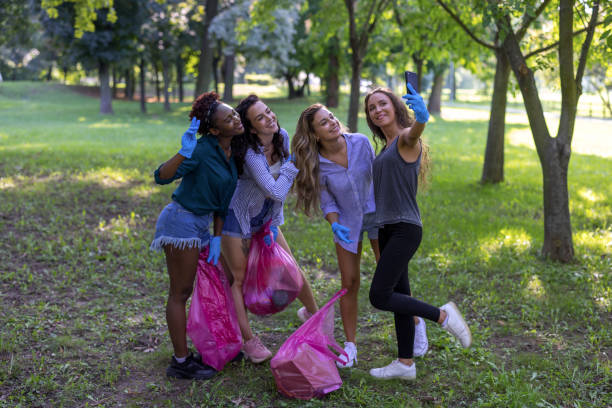istock Multiracial group of volunteers posing for selfie 1469933707