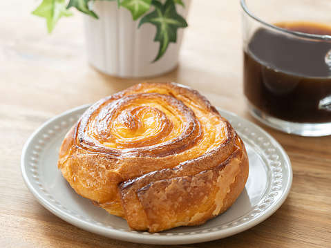 Danish pastry and cup of coffee