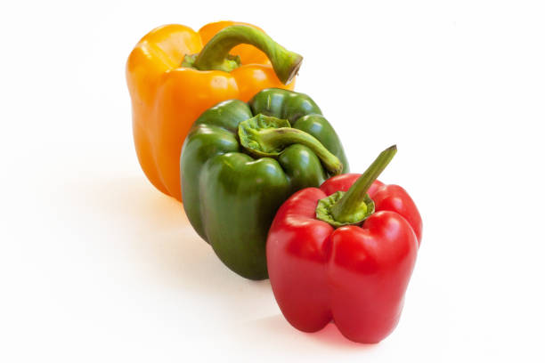 Green, yellow, red peppers stock photo