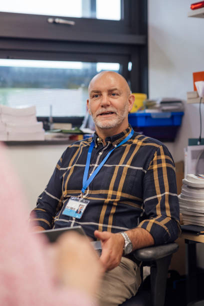 istock Teacher Leading a Meeting 1469940847