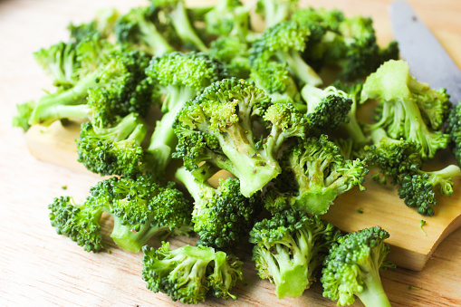 Broccoli crucifer raw vegetable closeup isolated on white background