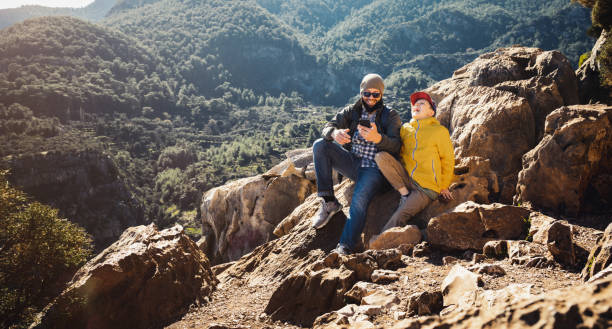 istock Father and son having fun travelling in mountains 1469942101