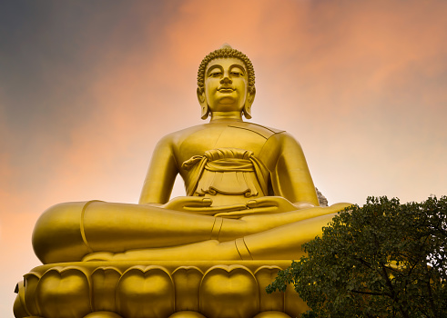 Sunset view with the giant Buddha statue. Samutsakhon province, Thailand.