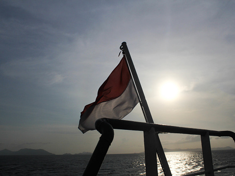 Indonesian flag silhouette on a ship