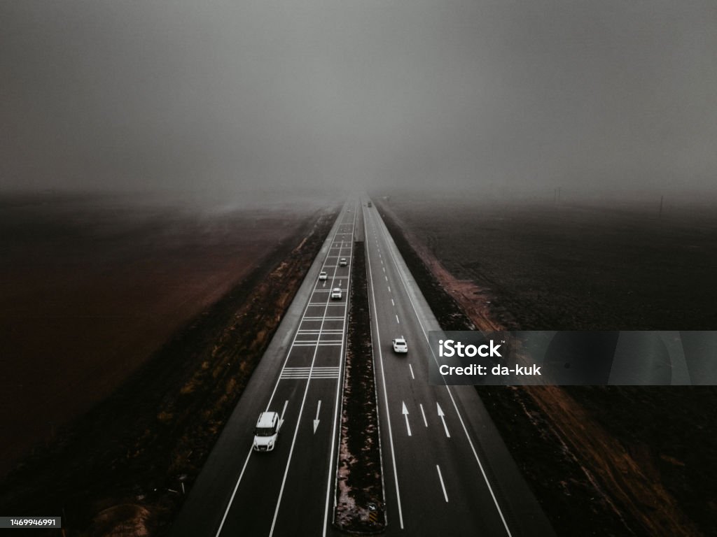 Highway road in dense fog. Aerial shot Highway Stock Photo