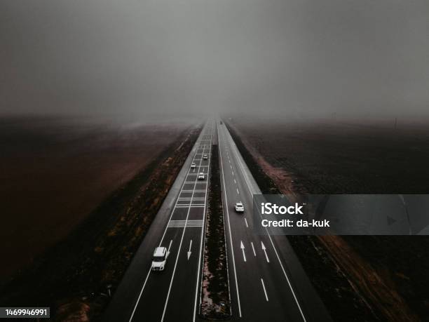 Highway Road In Dense Fog Aerial Shot Stock Photo - Download Image Now - Highway, Travel, Road Marking