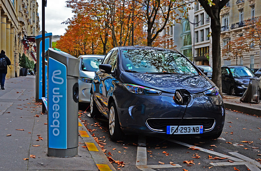 Paris, France - October 24th 2019 : Electric Renault Zoé parked in a street, in charge. This cars are the new Autolib (cars in free use service) of Paris.