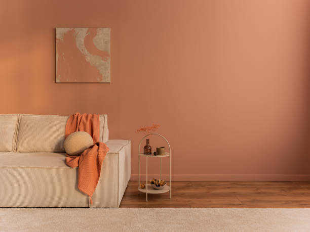 istock Aesthetic composition of living room interior with mock up poster frame, copy space, modular sofa, beige carpet, salmon pink plaid, round pillow and personal accessories. Home decor. Template. 1469948673